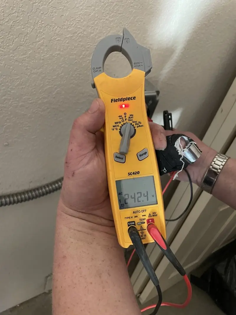 Voltage testing with clamp meter during Generator Installation in San Lorenzo